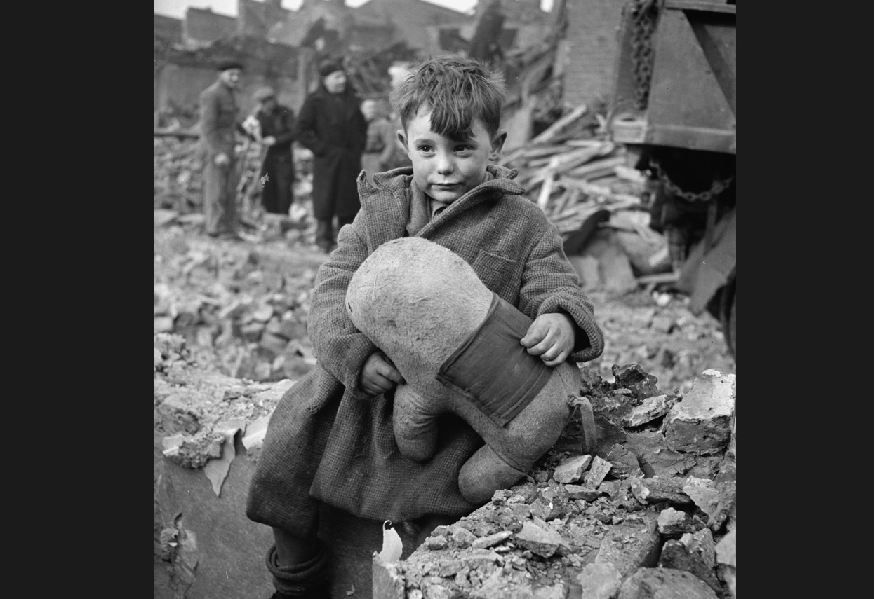 41 A child hangs onto his teddy looking for serenity amongst the devastation of war london 1940 01