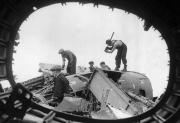 06 British workers salvage Aluminum from wrecked German raiders shot down over England Aug 26 1940 01