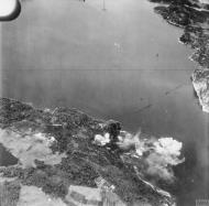 Asisbiz Fleet Air Arm Skuas attack the oil tanks and jetty at Dolvik near Bergen Norway 1940 IWM A82