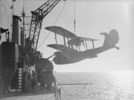 Asisbiz Fleet Air Arm Walrus being hoisted out to go on patrol HMS Suffolk Jun 1941 IWM A4184