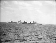 Asisbiz Cruisers firing furthest to nearest HMS Berwick Newcastle and Southhampton Nov 1940 IWM A2347