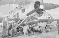 Asisbiz Fleet Air Arm Fairey Swordfish 5F being armed with a torpedo aboard HMS Ark Royal Apr 1941 IWM A3814