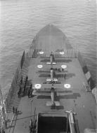 Asisbiz RN carrier HMS Furious with Sopwith Camel aircraft arrayed on her forward flight deck IWM SP1159