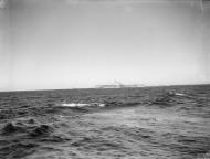 Asisbiz RN carrier HMS Implacable ploughing through Northern seas off Norway 27th Sep 1944 IWM A26177