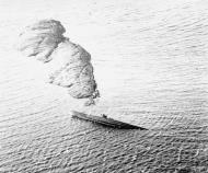 Asisbiz U boat driven ashore in a damaged condition and abandoned by her crew Norway 27th Sep 1944 IWM A26167
