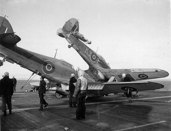 Fleet Air Arm Sea Hurricane KIF NF728 after being struck by Hurricane NF722 aboard escort carrier HMS Ravager 02