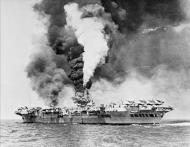 Asisbiz RN carrier HMS Victorious at fire after being struck by a Kamikaze off Sakishima Gunto IWM A29717