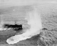 Asisbiz RN escort carrier HMS Vindex aircraft drops its depth charges on approach during Atlantic convoy duties Mar 1944 IWM A22732