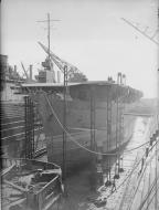 Asisbiz RN merchant carrier or MAC ship HMS Empire Macalpine in dry dock at Messrs Cammel Lairds at Birkenhead IWM A18007