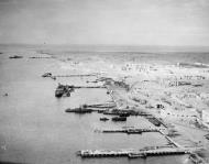 Asisbiz Aerial picture of Tobruk shows ships, some sunken and other afloat Cyrenaica Libya IWM C5496