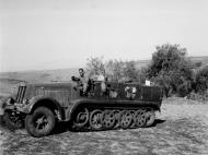 Asisbiz Captured SdKfz 7 half track being driven by a British soldier Sicily 1943 NAM197503631444