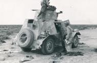 Asisbiz German DAK Afrika Korps recon unit advancing into Libya stop to inspect abandoned British vehicles ebay 01