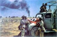 Asisbiz German DAK Afrika Korps supply unit transport vehicles display a flag to warn off friendly aircraft fire North Africa 01