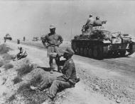 Asisbiz German armor DAK Panzer PzKpfw III tanks near Acroma retreating back to the west of Tobruk NIOD