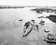 Asisbiz Aerial View Showing Salvage of the USS Oklahoma (BB 37) Pearl Harbor Hawaii 19th Mar 1943 80 G 410534
