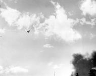 Asisbiz Japanese Zero trailing smoke after it was hit by anti aircraft fire during the attack Pearl Harbor Attack 7th Dec 1941 80 G 19931