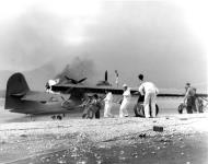 Asisbiz Sailors attempt to save a burning PBY at Naval Air Station Kaneohe Bay Oahu Pearl Harbor Attack 7th Dec 1941 NH 97432