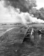 Asisbiz USS Oglala (CM 4) capsized and sinking after the Japanese attack on Pearl Harbor 7th Dec 1941 80 G 32537
