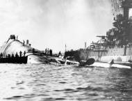 Asisbiz USS Oklahoma (BB 37) capsized and the USS Maryland (BB 46) after the Japanese attack on Pearl Harbor 7th Dec 1941 80 G 32741