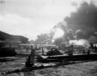 Asisbiz Wrecked planes at Ford Island seaplane base as the USS Shaw (DD 373) explodes in the center 7th Dec 1941 80 G 19948
