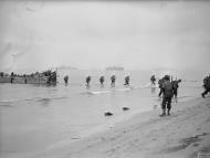 Asisbiz American troops landing on the beach at Arzeu near Oran from landing craft LCA 26 Nov 1942 IWM A12648