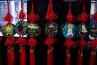 Asisbiz Jade Buddha Temple Ji Jong Hall area gift shops hanging medallions 01