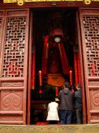 Asisbiz Great Hall northern entrance golden statue of with Shan Cai at her side 01