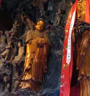 Asisbiz Great Hall northern entrance golden statue of with Shan Cai at her side 06