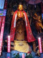 Asisbiz Great Hall northern entrance golden statue of with Shan Cai at her side 11