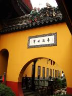 Asisbiz Jade Buddha Temple architecture featuring round entrance and ornate roofing decor 01