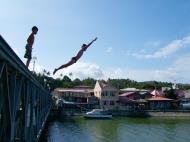 Asisbiz Kids diving of Naujan Estrella bridge Oriental Mindoro Philippines Feb 2006 05