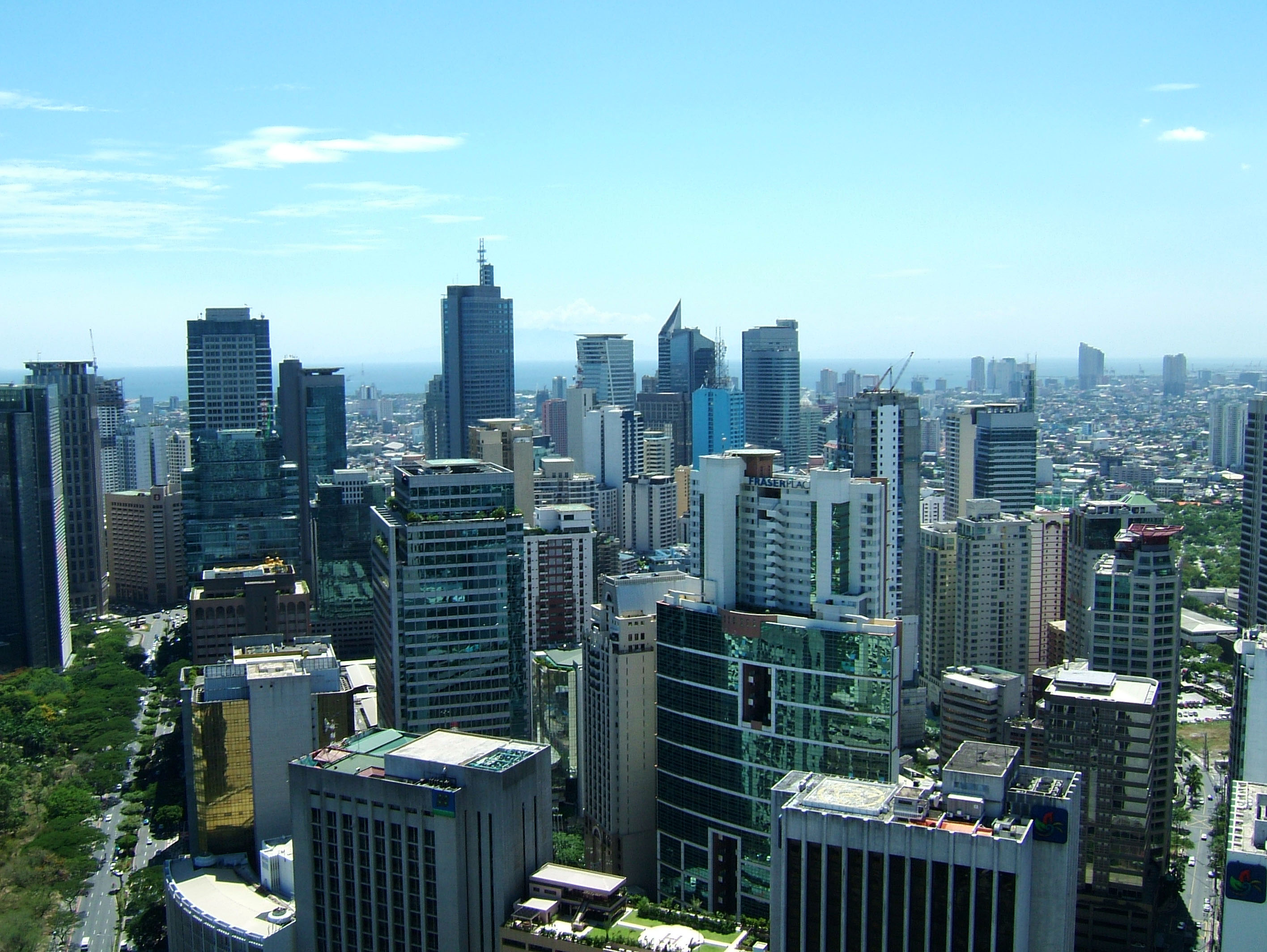 Philippines, Luzon, Manila. Makati business district with Louis