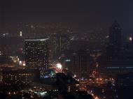 Asisbiz Covered in smoke after a firework barrage Makati celebrates New Year Roxas Traiangle Makati Philippines 2004 01