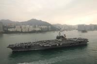 Asisbiz USN color photo Aircraft Carrier USS Kitty Hawk (CV 63) steams into Victoria Harbor HK Nov 2006