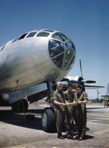 Asisbiz WWII color photo of crew members as they consult a map under the nose of a B 29 Superfortress 01