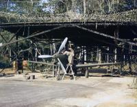 Asisbiz WWII USAAF color photo of Bell P 39 Airacobra Technicians installing a Trimetrogon Camera 01