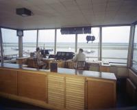Asisbiz WWII color photo of USAAF Control Tower signaling to aircraft on ground 01