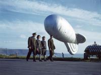 Asisbiz Two pilots from Bay of Biscay Patrol and WAF pass a RAF Barrage Balloon at Plymouth England 1943