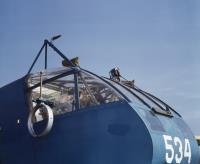 Asisbiz WWII USAAF color photo of a Mechanic working on a Waco CG 4A Glider number 534