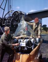 Asisbiz B 24H Liberator 8AF 466BG coded U+ being repaired after flak damage to its engine England 1944 01
