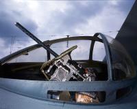 Asisbiz Gunner Sights His 50 Caliber Machine Gun in Blister Turret of PBY