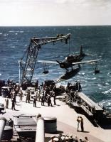 Asisbiz Vought OS2U Kingfisher floatplane is hoisted on board after a flight during the ship's shakedown cruise circa August 1944