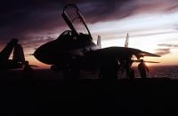 Asisbiz USN Grumman F 14A Tomcat VF 124 silhouetted against evening sky from USS Abraham Lincoln 1993