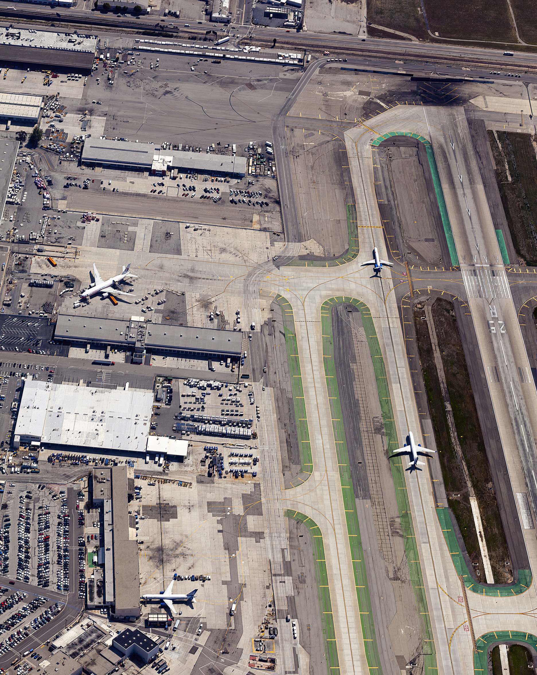 Aerial photo taken at 3,000 feet over LAX as a McDonnell Douglas MD 90 taxis for a 25R departure 03