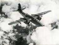 Asisbiz Douglas A 20G Havoc 9AF 410BG647BS 6QV in flight carrying 500 pound wing mounted bombs 1944 FRE11085