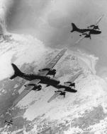 Asisbiz Douglas A 20G Havocs 9AF 416BG671BS 5C fly in formation over the coast of France as they return from a raid FRE11089