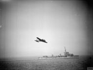 Asisbiz Avro Anson I RAF 48Sqn overflies HMS Whitehall during experimental tests with depth charge throwers IWM A4678