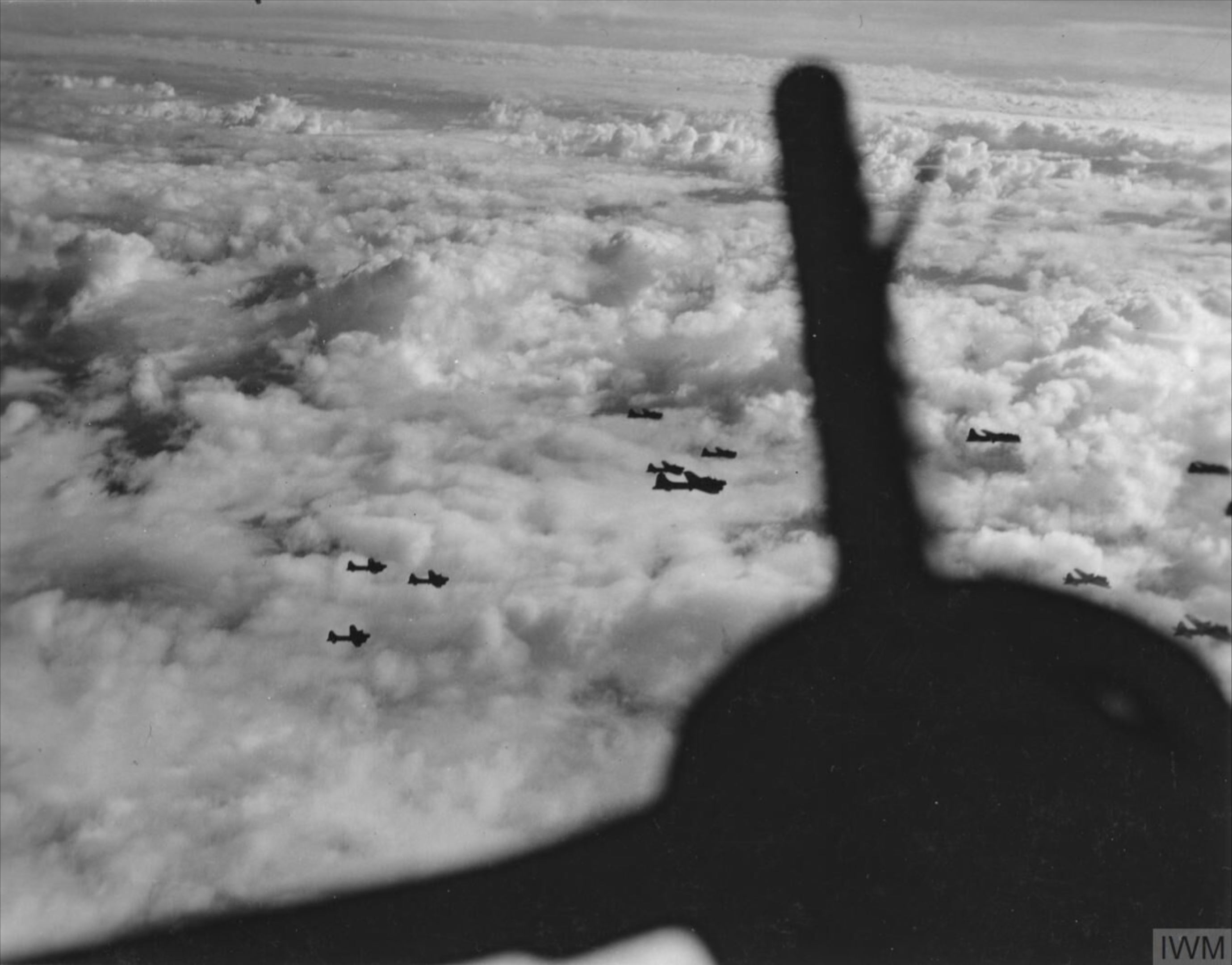 Boeing B-17F Fortresses 8AF 306th Bomb Group fly above the cloud cover in loose formation FRE4343