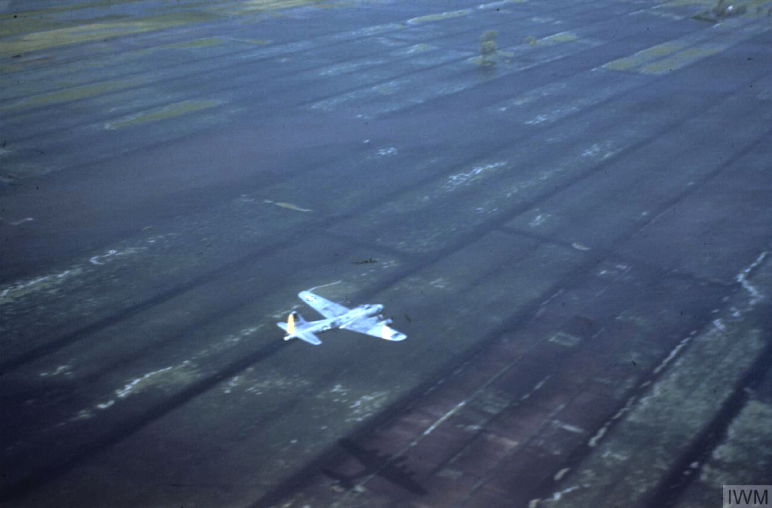 Boeing B-17G Fortress 8AF 390BG flies low over Dutch countryside during a food mission May 1945 FRE6494