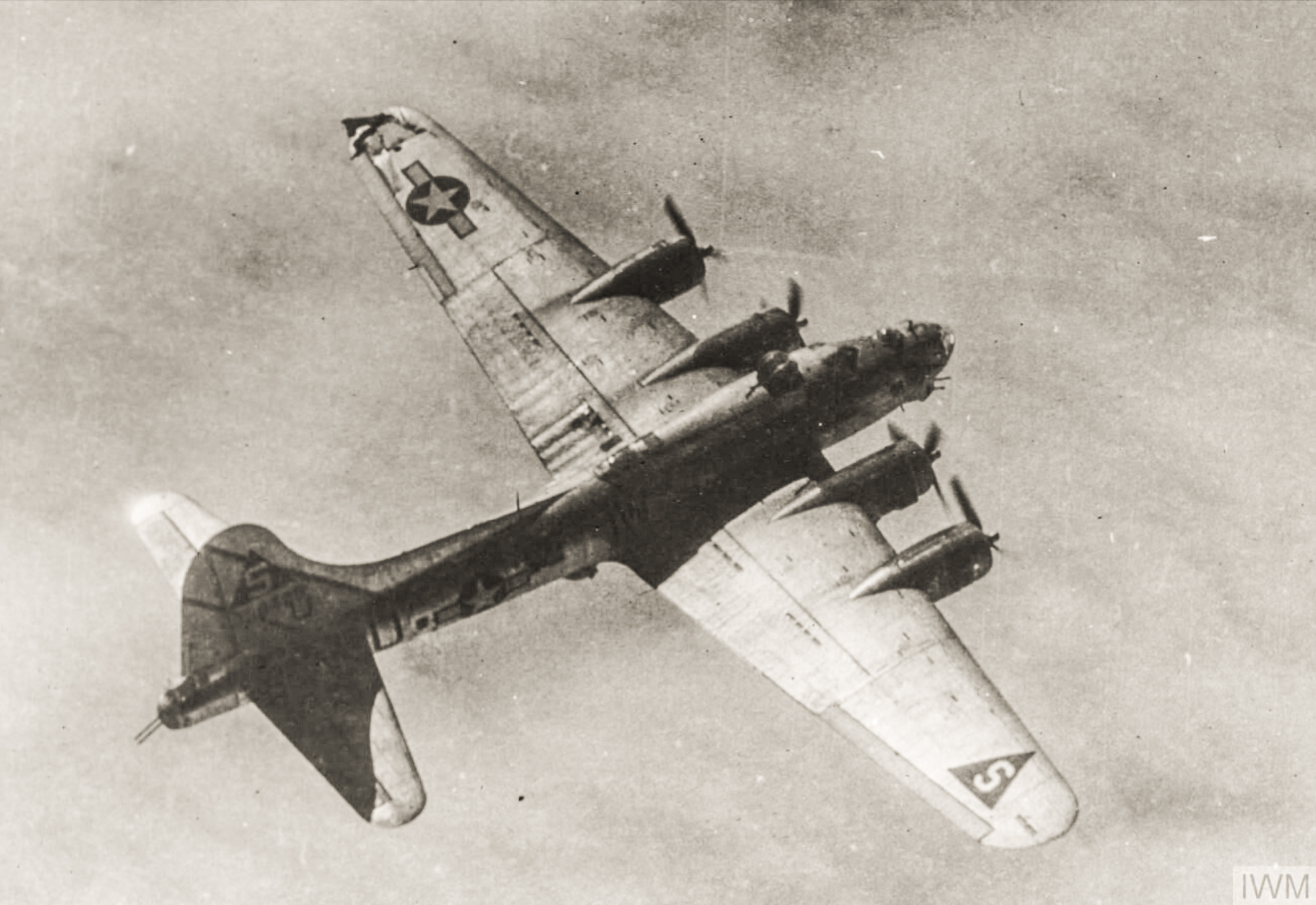 Boeing B-17G Fortress 8AF 401BG614BS IWU airborne in spite of the flak hole ripped into its left wing FRE1721